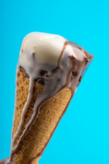 Fototapeta premium chocolate vanilla ice cream on blue background