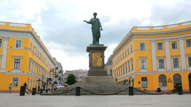 People walk near the famous monument to Duke de Richelieu on Primorsky Boulevard in the city of Odessa, Ukraine near the Potemkin stairs.