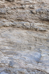 Superfície texturizada de rocha natural, onde se podem ver as linhas desenhadas na rocha longo do tempo. Pode ser usada como fundo.