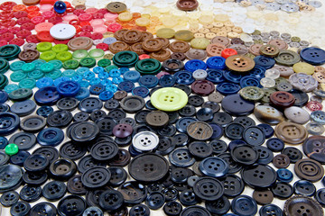 Buttons for clothes, different in color, shape, style, materials and manufacturing techniques