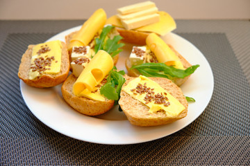 Fresh bread with cheese and basil for breakfast in a trip