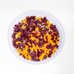 A cup with colorful vegetable salad 