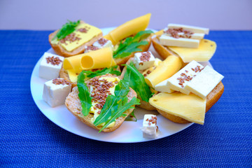 Fresh bread with cheese and basil for breakfast in a trip