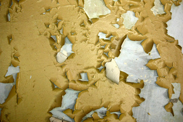 old dirty wall with yellow paint cracked from time to time, can be used as a background or texture