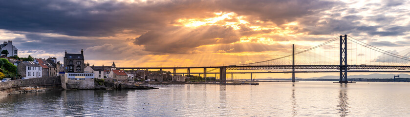 Fototapeta na wymiar Beautiful sunset at The Forth road bridge and Queensferry crossing bridge Edinburgh