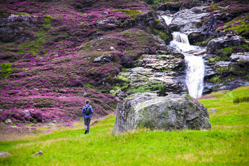 Scottish Highlands. Tourist walking to Falls of Unich. Glen Lee, Angus, Scotland, UK.