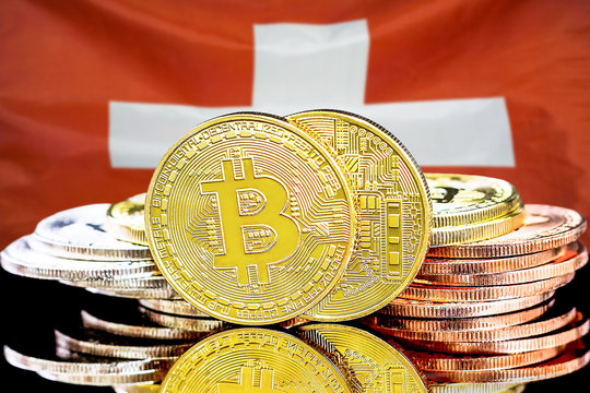 Concept for investors in cryptocurrency and Blockchain technology in the Switzerland. Bitcoins on the background of the flag Switzerland.