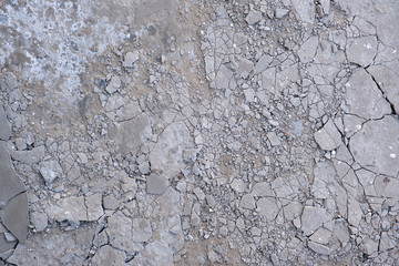 fragment of gray cracked cement floor