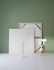 Pictures and chair in green studio with atmospheric lighting