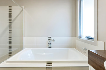 Fototapeta na wymiar Lavish bathtub and glass panel