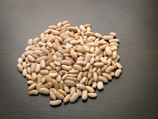 Arikara yellow  local bean seeds. Dried bean seeds on dark background.