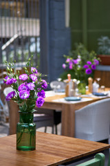 Fototapeta na wymiar Terrace, tables decorated with flowers. the restaurant is waiting for visitors in the restaurant. Close up