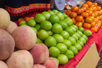 Jujube Peach Orange in street fruit shop