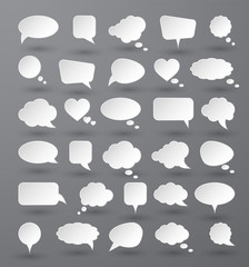 Fototapeta premium White paper speech bubbles on gray background. Vector illustration