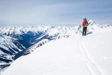 Backcountry skier on the summit of Youngs Peak in the Canadian Rocky Mountains. Photo on the...