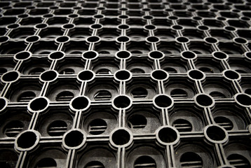 Fragment of cellular rubber mat for dirt removal