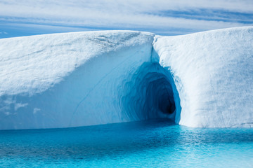 Deep ice cave entrance underwater on the Matanuska Glacier in Alaska.