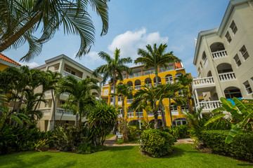Colorful resort condos with palm trees
