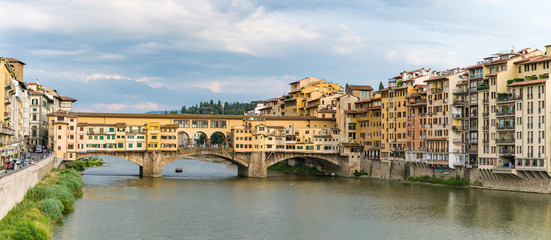 View of Arno River and medieval stone bridge Ponte Vecchio from the Ponte Santa Trinita in Florence, Tuscany, Italy