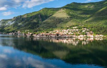 Fototapeta na wymiar Small village of Prcanj on coastline of Gulf of Kotor in Montenegro
