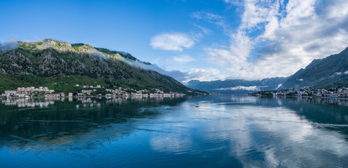 Fototapeta premium Small villages of Prcanj and Dobrota on coastline of Gulf of Kotor in Montenegro