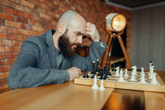 Male chess player playing, thinking process