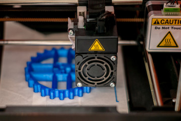 3D printer printhead while printing detail close-up - obrazy, fototapety, plakaty