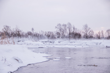 Morning dawn on the river. Pink sky. Winter landscape . Nature outside the city.