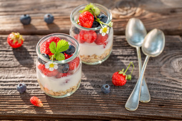 Top view of oat flakes with berries and yoghurt