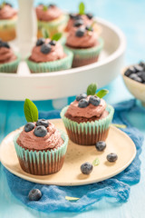 Muffin made of chocolate cream with blueberries