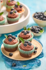 Homemade muffins with blueberries and chocolate cream