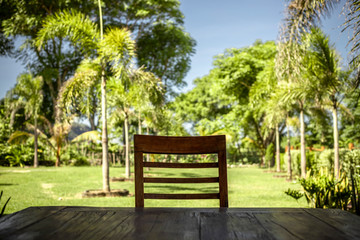 Obraz premium wooden cheer in resort with palms