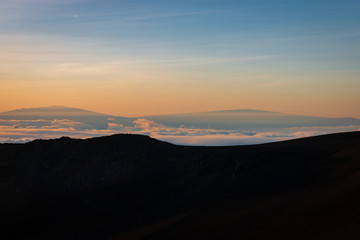 Mauna Kea seen from Haleakala Crater at sunrise, Hawaii, USA