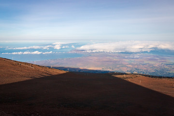 Conical shadow of Haleakala volcano at sunrise on the Hawaiian island of Maui, USA