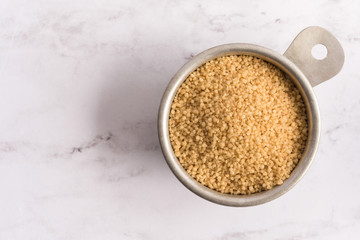 Whole Wheat Couscous in a Measuring Cup