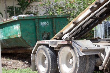residential  construction site debris collected in roll-off dumpster for efficient disposal