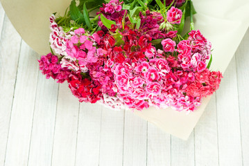 sweet william flowers on white wooden table