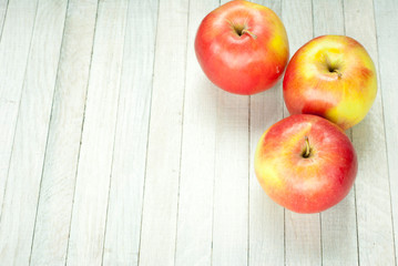 apples on white wooden table