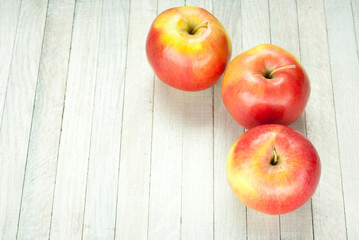 apples on white wooden table