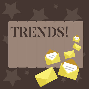 Conceptual hand writing showing Trends. Concept meaning General projected directions of something according to time Closed and Open Envelopes with Letter on Color Stationery