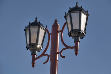 Fototapeta na wymiar street lamp against the blue sky
