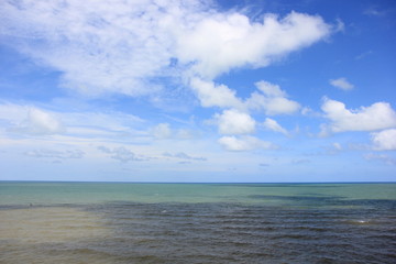 Blue sky with clouds over the sea for background, wallpapers, seascape and clear sky background.