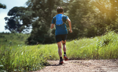 Asian men are running a trail In the natural path