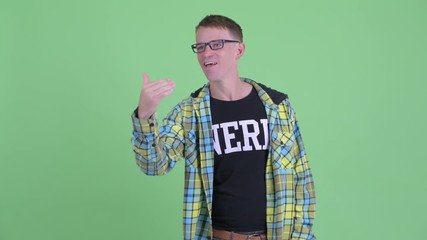 Happy nerd man with eyeglasses waving hand