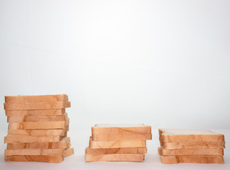 Heap of Stacked Sliced Bread isolated on White Background.