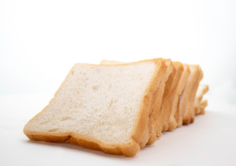 Loaf of sliced bread isolated on a white background.