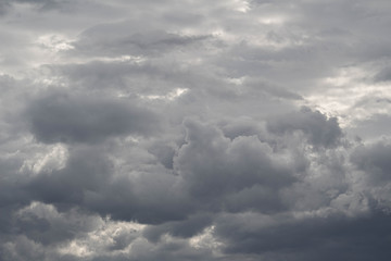 Obraz premium The Dark gray dramatic sky with large clouds in rainy seasons.