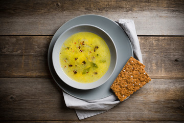 Hot pea soup with spices on the rustic background. Selective focus. Shallow depth of field.