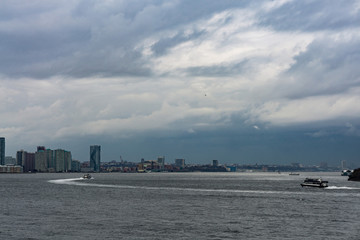 Fototapeta na wymiar November 2018 - Skyline of Manhattan, New York City, view from Liberty Island, ferry boat on the ocean