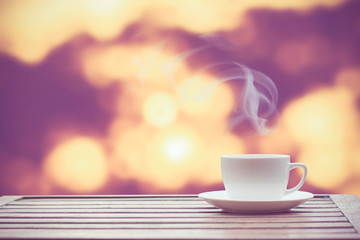 Coffee espresso on wood table nature background in garden,warm tone